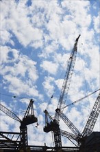 Cranes at construction site. Photo : fotog