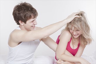 Playful couple in bed. Photo : Take A Pix Media