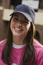 Pretty teenage girl wearing a ball cap. Photo : Stewart Cohen