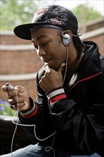 Teenage boy listening to music. Photo : Stewart Cohen