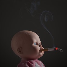 Cigarette in doll's mouth. Photo : Mike Kemp