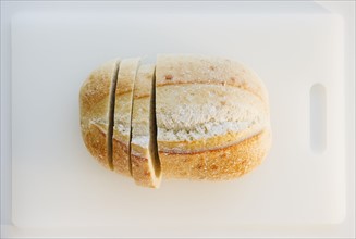 Freshly sliced bread on cutting board. Photo : Jamie Grill