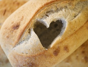 Heart cutout in loaf of bread. Photo : Jamie Grill