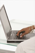 Woman's hand typing on laptop. Photo : K.Hatt
