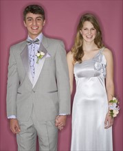 Couple dressed up for their prom.