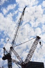 Cranes at construction site. Photo : fotog