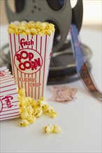 Popcorn and movie reel.