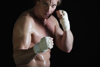 Boxer with taped hands. Photo : Daniel Grill