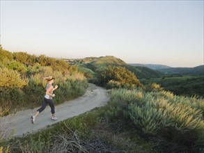 Woman trail running.
