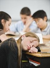 Student sleeping at her desk.