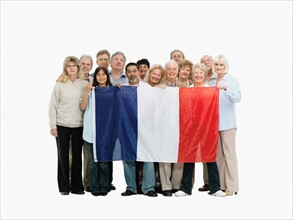 Group of people holding the flag of France. Photo : momentimages
