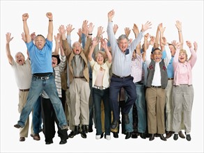 A group of excited people jumping for joy. Photo : momentimages