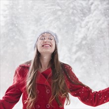 Happy woman outside on a snowy day. Photo : Mike Kemp