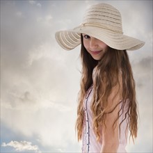 Beautiful long haired woman wearing a straw hat. Photo : Mike Kemp