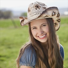 Smiling long haired cowgirl. Photo : Mike Kemp