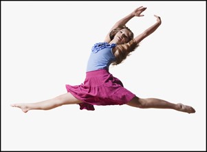 Female dancer jumping gracefully in the air. Photo : Mike Kemp