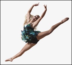 Female dancer jumping gracefully in the air. Photo : Mike Kemp