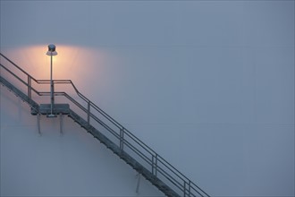Stairs and light on an oil tank. Photo : Dan Bannister
