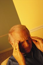 Man with a headache. Photo : Rob Lewine