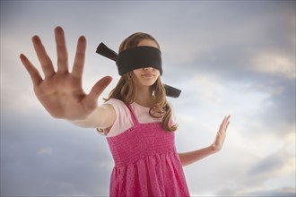 Blindfolded teenage girl. Photo : Mike Kemp