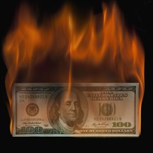 Burning 100 dollar bill. Photo : Mike Kemp
