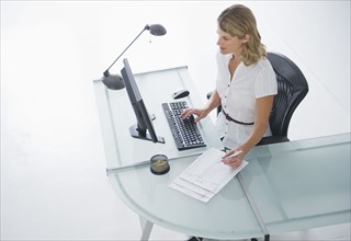 Businesswoman working on computer.