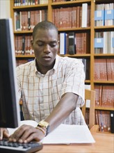 College student working in library.