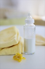 Baby bottle pacifier and blanket.