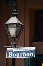 Lamp post and Bourbon Street sign in New Orleans.