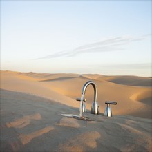 Faucet in desert. Photo. Mike Kemp