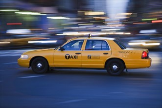 Taxi cab driving in the evening. Photo. Antonio M. Rosario