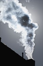 Smoke coming out of factory chimney. Photo. Antonio M. Rosario