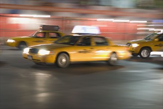 Taxi cabs driving. Photo. Antonio M. Rosario