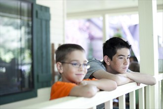 Two young boys gazing over railing. Photo : Tim Pannell