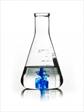 Blue liquid in beaker. Photo. David Arky