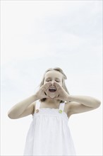 Cute girl shouting. Photo. momentimages