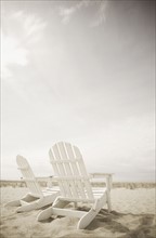 Adirondack chairs on the beach. Photo. Chris Hackett
