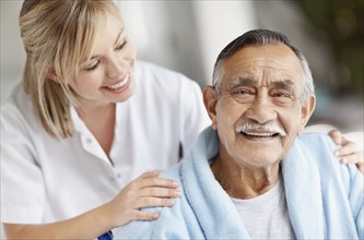 Nurse caring for senior patient. Photo. momentimages