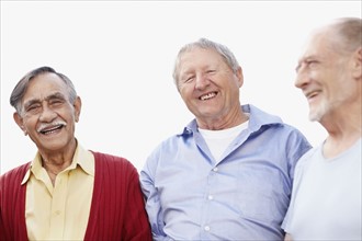 Three senior men laughing. Photo. momentimages