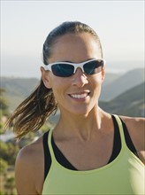 Trail runner wearing sunglasses.
