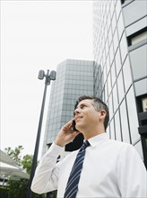 Businessman talking on cell phone. Photo. Erik Isakson