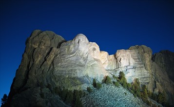 Mount Rushmore at night.