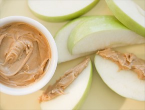 Peanut butter on sliced apple. Photo. Jamie Grill