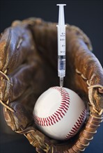Syringe in baseball. Photo. Jamie Grill