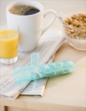 Prescription pills on breakfast table. Photo : Jamie Grill
