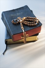 Rosary on bible.
