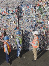 Workers at recycling plant.