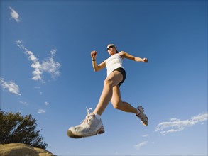 Trail runner jumping.