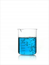 Blue liquid in measuring cup. Photo. David Arky