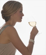 Sophisticated woman drinking wine.